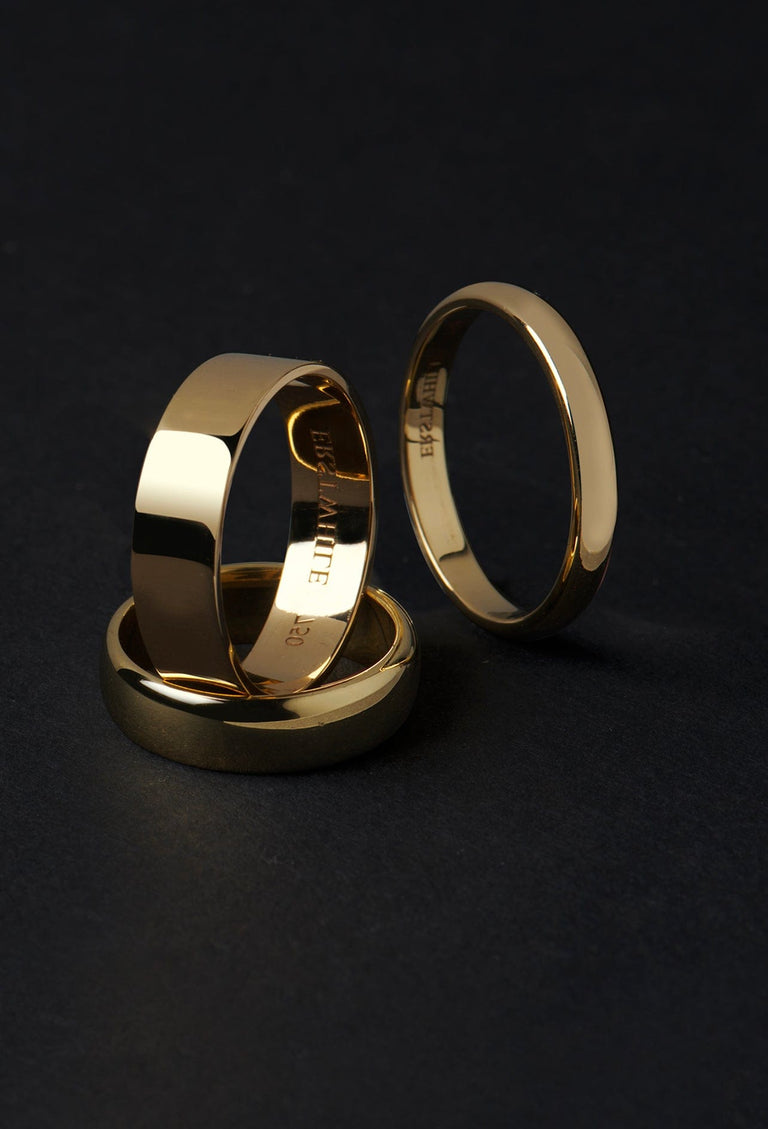 three men's wedding bands in gold