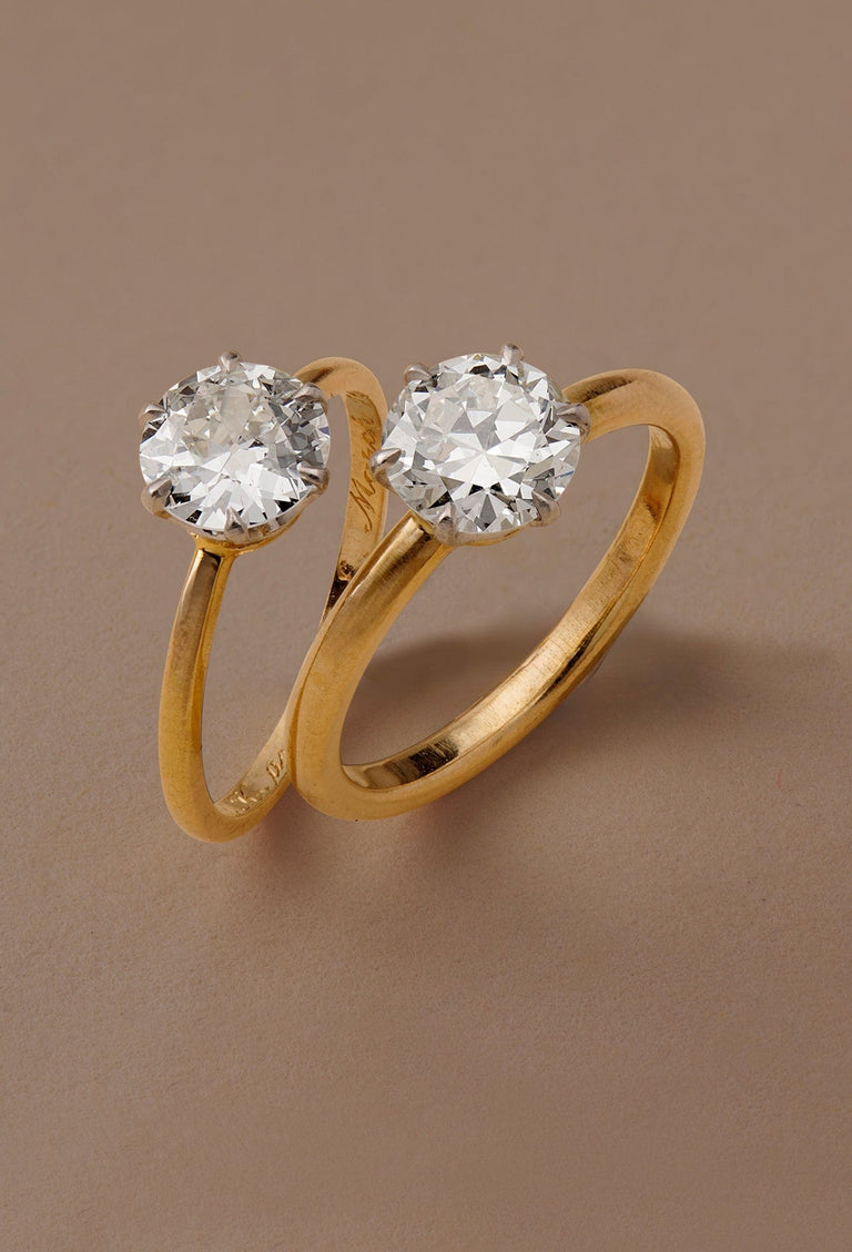 two vintage Tiffany and co. solitaire gold engagement rings