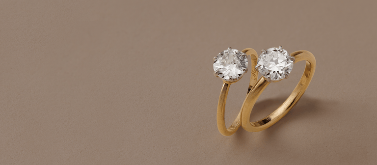 two vintage Tiffany and co. solitaire gold engagement rings